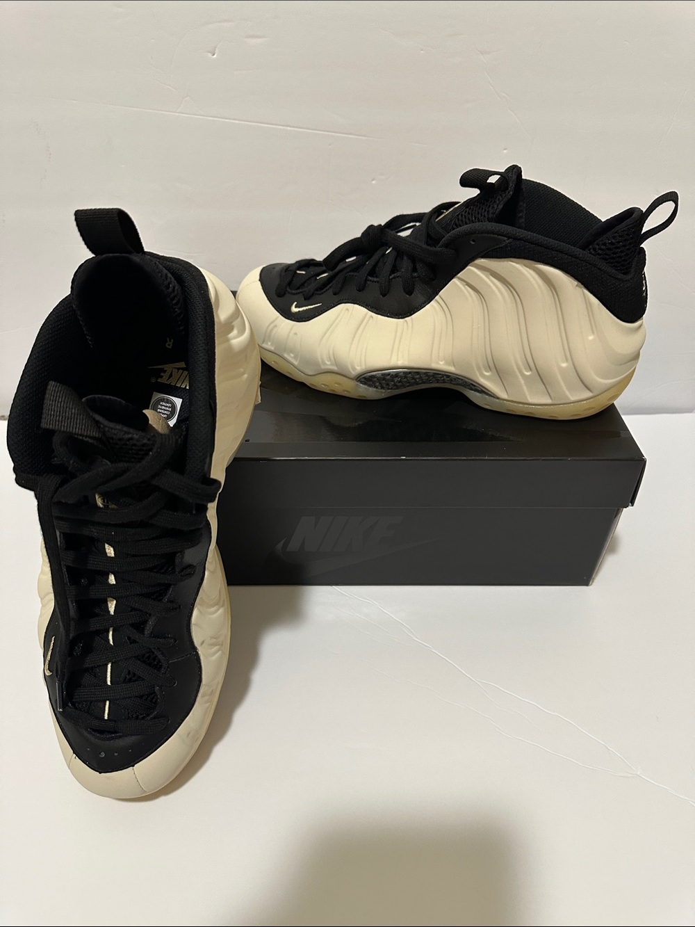 Nike Two-Tone Black and Cream Foamposite Sneakers